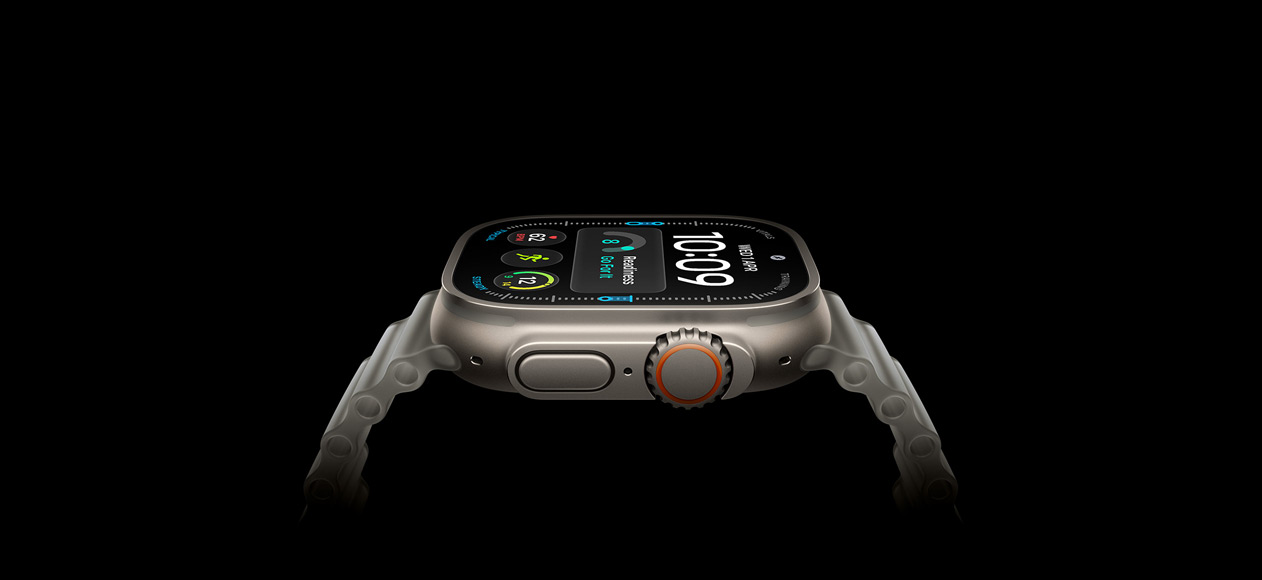 Apple Watch Ultra 4, titanium case, natural colour, right exterior, Digital Crown, raised side button, digital watch face, translucent grey Ocean Strap